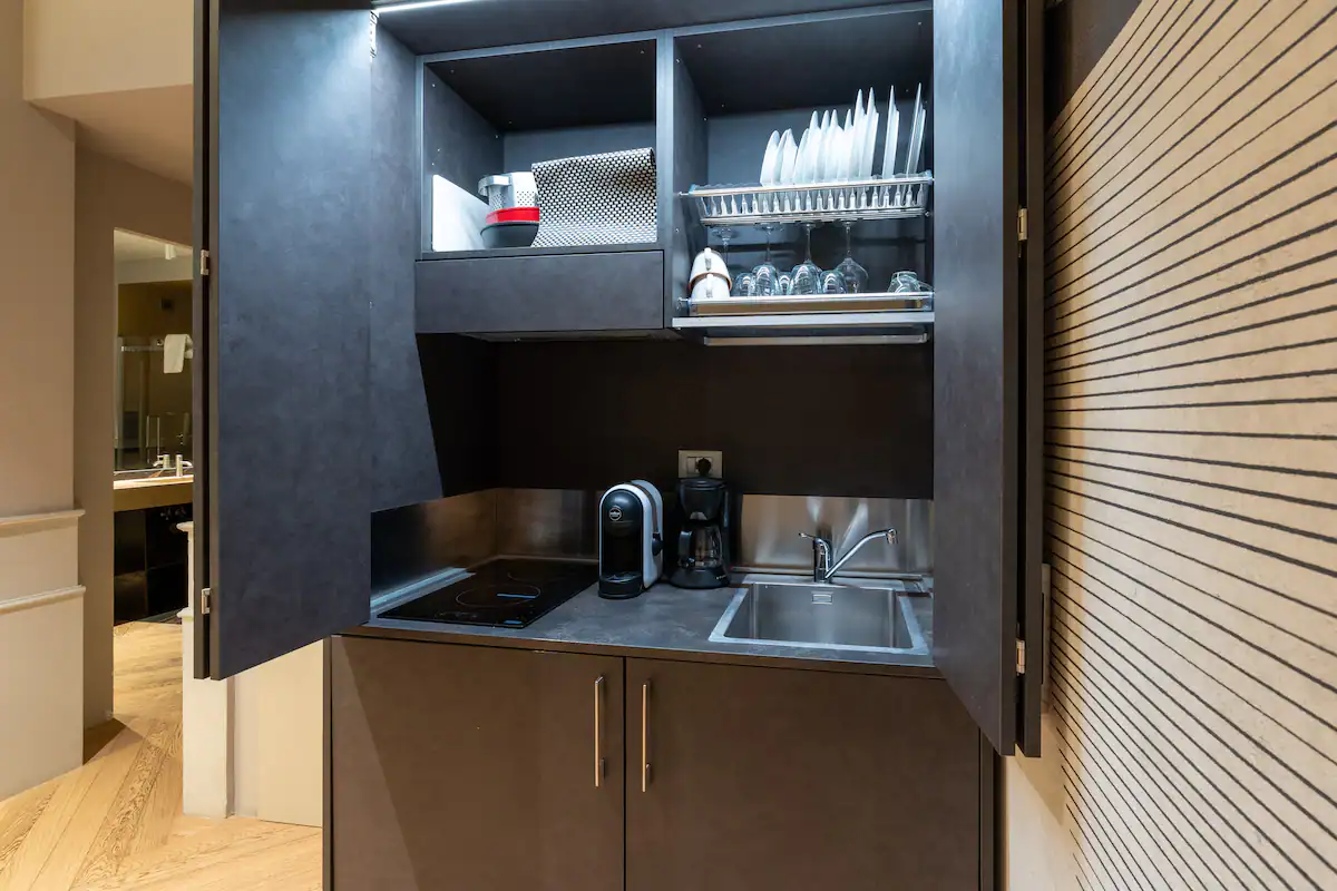 Compact designer kitchen in the Luxury Loft near Piazza di Spagna, Rome