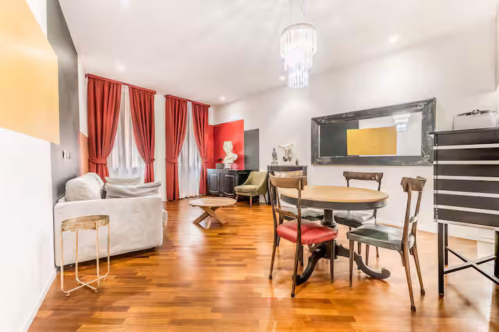 Living and dining room in Navona Charme, a 15th-century building near Piazza Navona, Rome