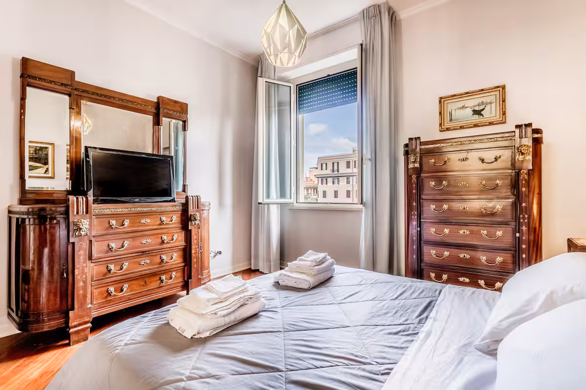Bedroom with window onto Roman rooftops in Sophisticated Vatican, Prati