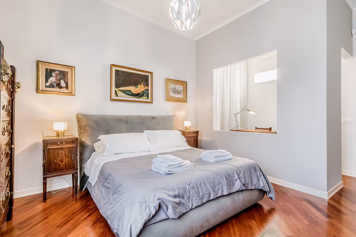 Bedroom with classic furniture in Sophisticated Vatican near Metro A Ottaviano